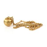 Vintage gold long chain with unusual globe pendant that opens to reveal four frames for photos,