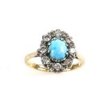 Turquoise and round brilliant cut diamonds set ring, central oval cabochon cut turquoise, framed by