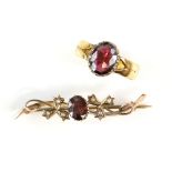 Late Victorian ring, centrally set with an oval cut garnet, estimated total weight 1.77 carats,