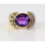 Gold ring set with an amethyst and diamond the mount of polished yellow gold and matt white gold,