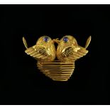 Cartier love birds brooch, the two facing birds in an openwork nest, their eyes two cabochon cut