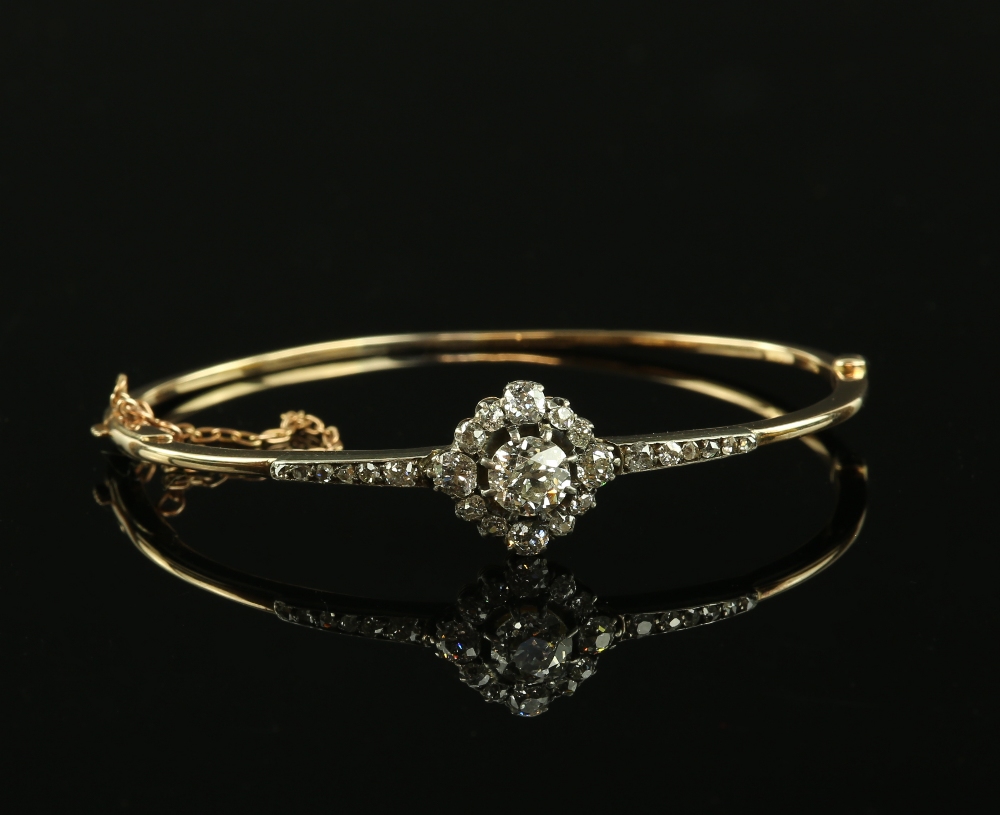 19th C diamond set bangle, central old cut diamond estimated at 0.80 carats, set in old and Rose cut