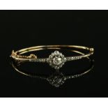 19th C diamond set bangle, central old cut diamond estimated at 0.80 carats, set in old and Rose cut