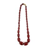 1930's Bakelite necklace, graduated oval beads strung without knots, measuring approximately 40cm in