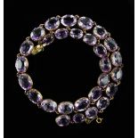 Victorian amethyst riviere necklace, graduated oval cut amethysts, largest amethyst 9.6 x 6.3mm,