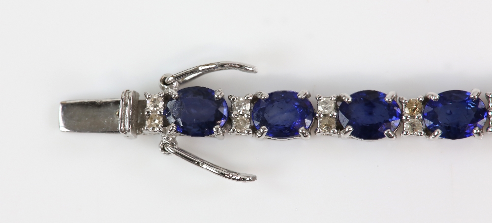 Sapphire diamond line bracelet; twenty-six oval faceted sapphires are four-claw set and alternated - Image 3 of 8