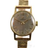 Omega ladies gold dress watch the silvered dial with baton hour markers, ,with Arabic numerals to