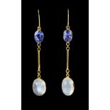 Moonstone and tanzanite drop earrings; oval cabochon cut moonstone suspended from an oval faceted