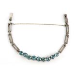 1940's blue zircon bracelet, mounted in 18 ct white gold, and two marcasite set brooches and a