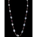 Moonstone and ruby necklace, collet set, gold wirework marked '585' for 14 ct, 72cm length.