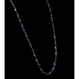 Sapphire necklace; pear and oval faceted sapphires spectacle set, 46cm length, mounted in 14 ct