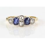Edwardian sapphire and diamond set ring, set with two oval sapphires and oval old cut diamonds,