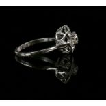 Old cut diamond flower cluster ring, central diamond estimated weight 0.40 carats, estimated total