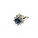 Modern sapphire and diamond dress ring, central pear cut sapphires, estimated weight 3.00 carats,