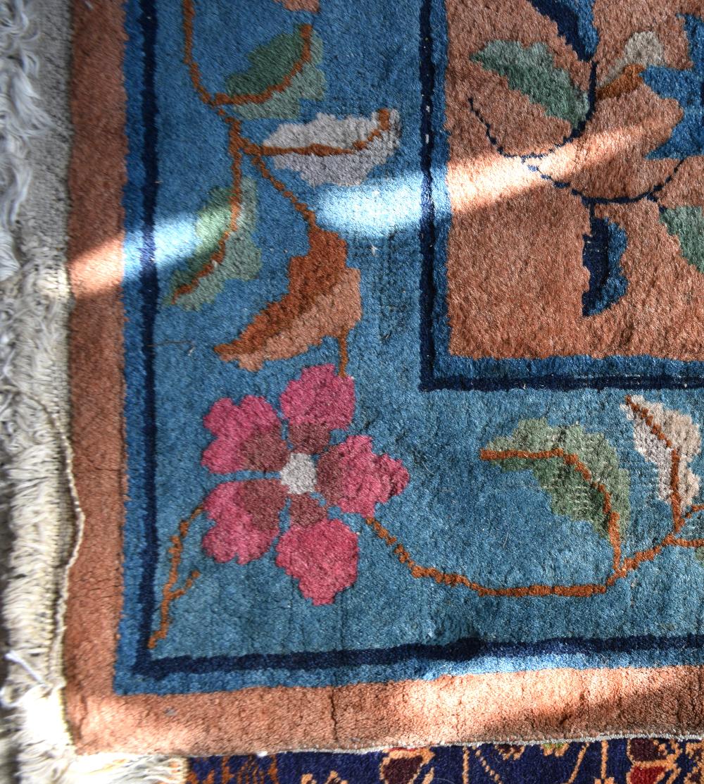 Chinese Orange ground rug with main blue border, the centre with cartouche and floral forms 188cm - Image 2 of 3