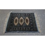 Bokhara blue ground rug. .