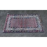 Persian Saraband red ground rug, 130cm x 76cm . .