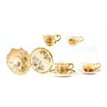 Royal Worcester blush ivory cabinet cup and saucer with scalloped and part reticulated rim, puce