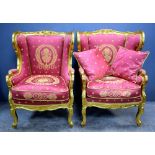 Pair 18th Century style carved gilt wood arm chairs with padded back arms and seat upholders in