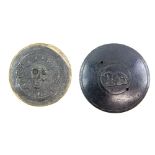 Two cast metal embossed discs, possibly a seal for attaching to a pilgrims flask, one relief moulded