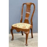 Queen Anne style walnut single chair with splat back on carved cabriole legs and pad feet,. .