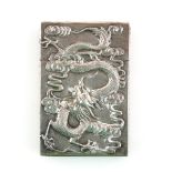 19th century Chinese silver card case decorated on one side with a dragon in relief and on the other