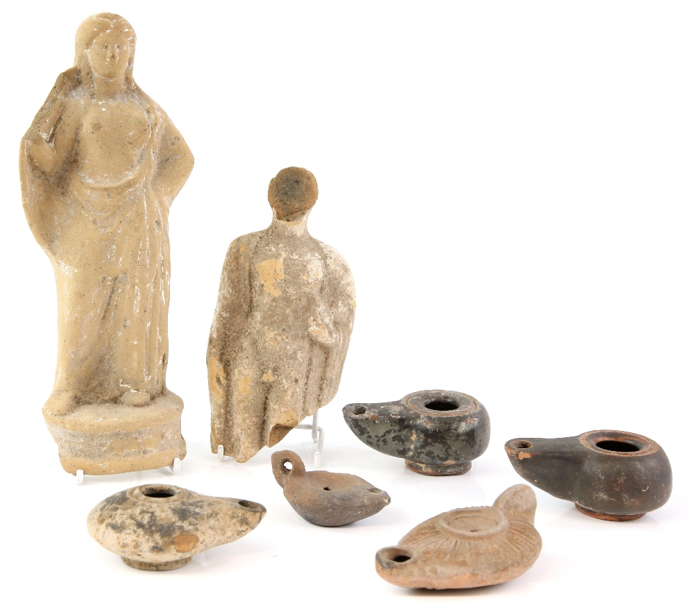 A group of antiquities including a Boeotian terracotta figure of a semi-draped female on a reel-