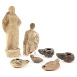 A group of antiquities including a Boeotian terracotta figure of a semi-draped female on a reel-