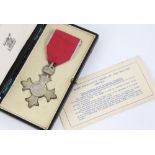 M.B.E. Medal in box. Vendor advises this was awarded to a member of the Baldwin family.. .