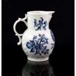 18th century English porcelain mask jug on moulded cabbage leaf decoration, produced either