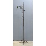 Late 19th century wrought iron adjustable standard lamp on quatrefoil base, 160cm h . .