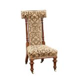 19th century walnut framed and upholstered nursing chair,. .