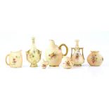 Royal Worcester blush ivory two miniature twin handled vases with floral decoration and gilt