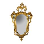 19th century carved giltwood and gesso mirror of scrolling and shell form, 72cm high, . .