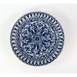 Dutch Delft 17th/18th century blue and white circular tin-glazed dish with central circular floral