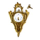 French gilt metal cartel clock the white enamel dial with blue Roman numerals, 30cm high. .