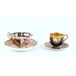 Royal Worcester cabinet cup and a Crown Derby cup and saucer . .