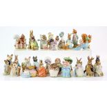 A collection of approx 43 Beswick Beatrice Potter figures brown printed and gold marks.. .