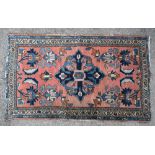 Persian rug with central floral motif, multiple borders, 130cm x 77cm,. .
