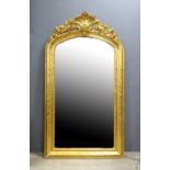 19th century gilt gesso wall mirror with foliate scroll crest, 153cm x 85cm. .