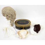Barrister's wig in a tin box marked with the name of the previous owner. .