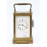 Early 20th century French brass and glass carriage clock with lever movement stamped 5676, 20cm . .