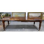 19th century mahogany extending dining table, on turned and carved supports, with two extra