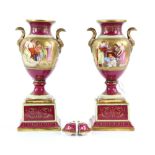 Pair of Royal Vienna urn shaped pedestal vases on square plinths, the central beaded gilt panels