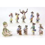 Nine Meissen and Meissen style porcelain Monkey band figures, the conductor h19cm, various marks,