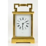 Brass and four glass carriage clock with lever movement, the white enamelled dial with Roman