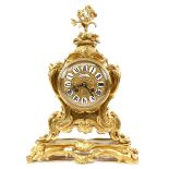 French gilt metal mantel clock, the dial with enamelled cartouches and Roman numerals, twin train