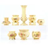 Royal Worcester blush ivory a pair of onion form vases with floral decoration and integral bases,