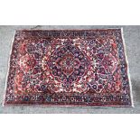 Persian rug with central floral medallion, repeating floral forms, multiple borders, 149cm x 105cm,.