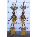 Pair of 20th century, large blackamoor figural nine light candelabra with painted decoration on